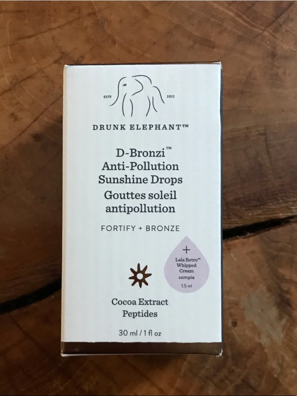 Drunk Elephant D-Bronzi Sunshine Drops Packaging - White & Brown Accents